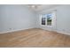 Bedroom with natural light, light blue walls and updated flooring at 120 Black Duck Cir, Daytona Beach, FL 32119