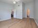 Spacious bedroom with hardwood flooring, a ceiling fan, and access to an ensuite bathroom at 120 Black Duck Cir, Daytona Beach, FL 32119