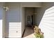 Covered front entryway with security lighting and well-maintained landscaping at 120 Black Duck Cir, Daytona Beach, FL 32119