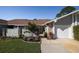 Attractive home with stone accents, fresh landscaping, and an inviting walkway to the front door at 120 Black Duck Cir, Daytona Beach, FL 32119