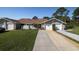Charming home with stone accents, well-maintained landscaping, and a two-car garage at 120 Black Duck Cir, Daytona Beach, FL 32119