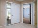 Inviting front door with decorative glass window and tile flooring leading to interior rooms at 120 Black Duck Cir, Daytona Beach, FL 32119
