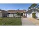 Charming home with a well-maintained lawn, stone accents, and an attached one-car garage at 120 Black Duck Cir, Daytona Beach, FL 32119