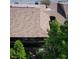 Aerial view of the building's roof surrounded by lush green trees at 120 Hibiscus Woods Ct # 14D, Deltona, FL 32725