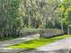 Side view of community bridge surrounded by greenery at 120 Hibiscus Woods Ct # 14D, Deltona, FL 32725
