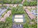 Aerial view of community with tennis courts and pool at 120 Hibiscus Woods Ct # 14D, Deltona, FL 32725