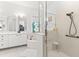 Bright bathroom with glass enclosed shower, bathtub and sink with vanity at 1205 Draycott St, Ormond Beach, FL 32174