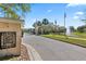 Elegant gated entrance to Chelsea Place with meticulously maintained landscaping and water feature at 1205 Draycott St, Ormond Beach, FL 32174
