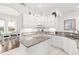 Bright kitchen featuring granite countertops, a center island, white cabinetry, and an open layout at 1205 Draycott St, Ormond Beach, FL 32174