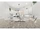 A kitchen with granite countertops, stainless steel appliances, and white cabinetry offers a modern aesthetic at 1205 Draycott St, Ormond Beach, FL 32174