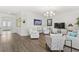 Open floor plan with hardwood floors, neutral walls, and a combined living and dining area at 1205 Draycott St, Ormond Beach, FL 32174