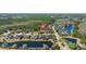Aerial view of a residential neighborhood surrounded by mature trees and scenic ponds at 1205 Draycott St, Ormond Beach, FL 32174