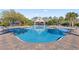 Inviting community pool with clubhouse and lounge chairs, creating a perfect spot for relaxation and socializing at 1205 Draycott St, Ormond Beach, FL 32174