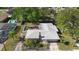 An aerial view of the home showing the backyard pool, unique patio, and mature landscaping at 1254 Mardrake Rd, Daytona Beach, FL 32114