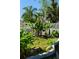 Backyard zen garden includes banana trees, tropical plants, and a pond at 1254 Mardrake Rd, Daytona Beach, FL 32114