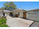 Spacious backyard with concrete patio, wooden gate, and a view of the home's exterior at 1254 Mardrake Rd, Daytona Beach, FL 32114