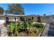 Expansive backyard with lush foliage, pergola and pond at 1254 Mardrake Rd, Daytona Beach, FL 32114