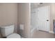 Bathroom with toilet, vanity and tub shower combo with white tile at 1254 Mardrake Rd, Daytona Beach, FL 32114