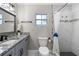 Updated bathroom showcases a granite countertop, decorative mirror, and a tiled shower at 1254 Mardrake Rd, Daytona Beach, FL 32114