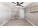 Spacious bedroom with tile floors, ceiling fan, and closet at 1254 Mardrake Rd, Daytona Beach, FL 32114