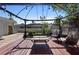 Backyard deck under pergola with outdoor chairs and serene garden view at 1254 Mardrake Rd, Daytona Beach, FL 32114