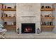 Stylish fireplace with stone detailing, built-in shelving, and decorative accents at 1254 Mardrake Rd, Daytona Beach, FL 32114