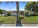Well-maintained one-story home with a welcoming front porch and mature landscaping at 1254 Mardrake Rd, Daytona Beach, FL 32114
