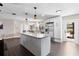 Bright, open kitchen featuring a granite-topped island and stainless steel appliances at 1254 Mardrake Rd, Daytona Beach, FL 32114