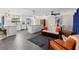 Open floor plan with updated kitchen featuring stainless appliances and a breakfast bar that opens to the living room at 1254 Mardrake Rd, Daytona Beach, FL 32114