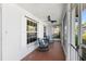 Inviting screened-in porch with comfortable seating and a ceiling fan at 1254 Mardrake Rd, Daytona Beach, FL 32114