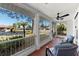 Comfortable screened porch with outdoor seating, ceiling fan, and a lovely view of the neighborhood at 1254 Mardrake Rd, Daytona Beach, FL 32114