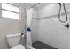 White tiled shower features decorative accent tiles, a black shower head and fixtures at 1254 Mardrake Rd, Daytona Beach, FL 32114