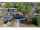 Overhead view of the home with a fenced yard, nearby shed, and ample parking space at 1304 Genmar St, Daytona Beach, FL 32117