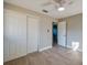 This bedroom features a ceiling fan, hardwood floors and a closet with white paneled doors at 1304 Genmar St, Daytona Beach, FL 32117
