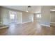 Spacious living room featuring new light wood flooring, a neutral color palette, and ample natural light at 1304 Genmar St, Daytona Beach, FL 32117