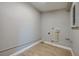 Empty room with new flooring and neutral walls and some plumbing at 1304 Genmar St, Daytona Beach, FL 32117