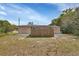 View of the backyard featuring a wooden fence and potential for outdoor activities at 1434 Deltona Blvd, Deltona, FL 32725