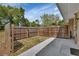Enclosed backyard area with a concrete patio and wooden fence for privacy at 1434 Deltona Blvd, Deltona, FL 32725