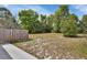 Spacious backyard featuring a wooden fence, ideal for outdoor enjoyment at 1434 Deltona Blvd, Deltona, FL 32725