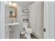Stylish bathroom with decorative mirror, vanity, and tiled floor at 1434 Deltona Blvd, Deltona, FL 32725