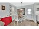 Cozy dining area with bright natural light, featuring modern decor and direct access to the front door at 1434 Deltona Blvd, Deltona, FL 32725