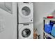 Laundry area with stacked washer and dryer, with shelves for storage at 1434 Deltona Blvd, Deltona, FL 32725