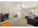 Carpeted bedroom with large windows, ample space, neutral color palette, and ceiling fan at 1450 Shady Meadow Ln, Deland, FL 32724