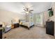Cozy bedroom with carpet flooring, crown molding, and large windows covered by shutters at 1450 Shady Meadow Ln, Deland, FL 32724