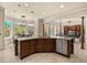 Open kitchen with a large island, granite countertops, and stainless steel appliances at 1450 Shady Meadow Ln, Deland, FL 32724