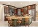 Chef's kitchen with custom island, granite countertops, and top-of-the-line stainless steel appliances at 1450 Shady Meadow Ln, Deland, FL 32724