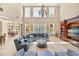 Bright living room with high ceilings, large windows, and stylish furnishings with pool view at 1450 Shady Meadow Ln, Deland, FL 32724
