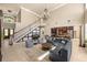 Expansive living area featuring a grand staircase, stylish seating, and elegant decor at 1450 Shady Meadow Ln, Deland, FL 32724