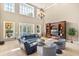Spacious living area with soaring ceilings, elegant chandelier, and views of the outdoor pool at 1450 Shady Meadow Ln, Deland, FL 32724