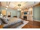 Spacious main bedroom with a fireplace, built-in shelves, and a decorative ceiling at 1450 Shady Meadow Ln, Deland, FL 32724